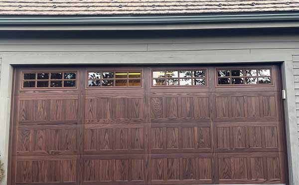 Wooden garage door with top windows