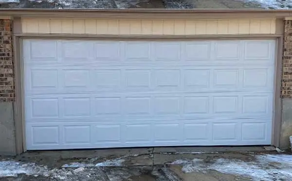 White residential garage door with pattern design