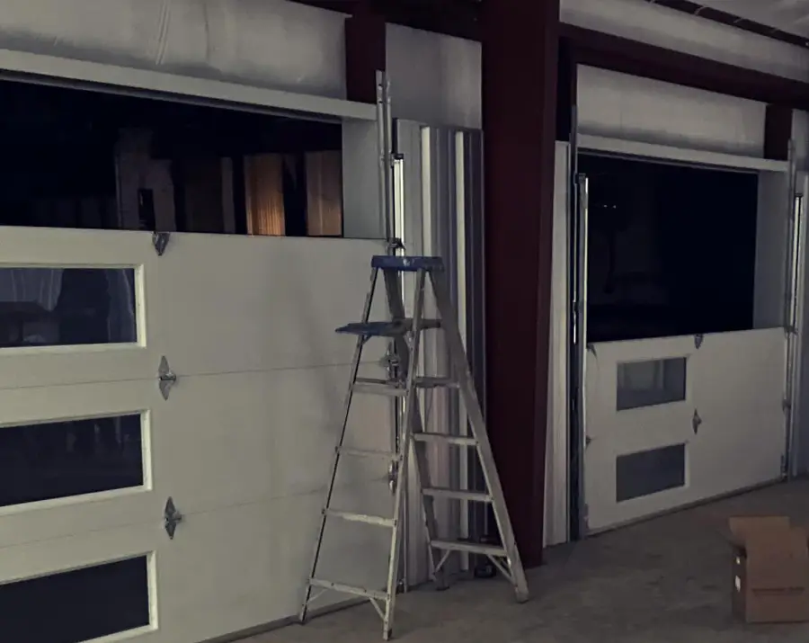 Garage doors with ladder in warehouse