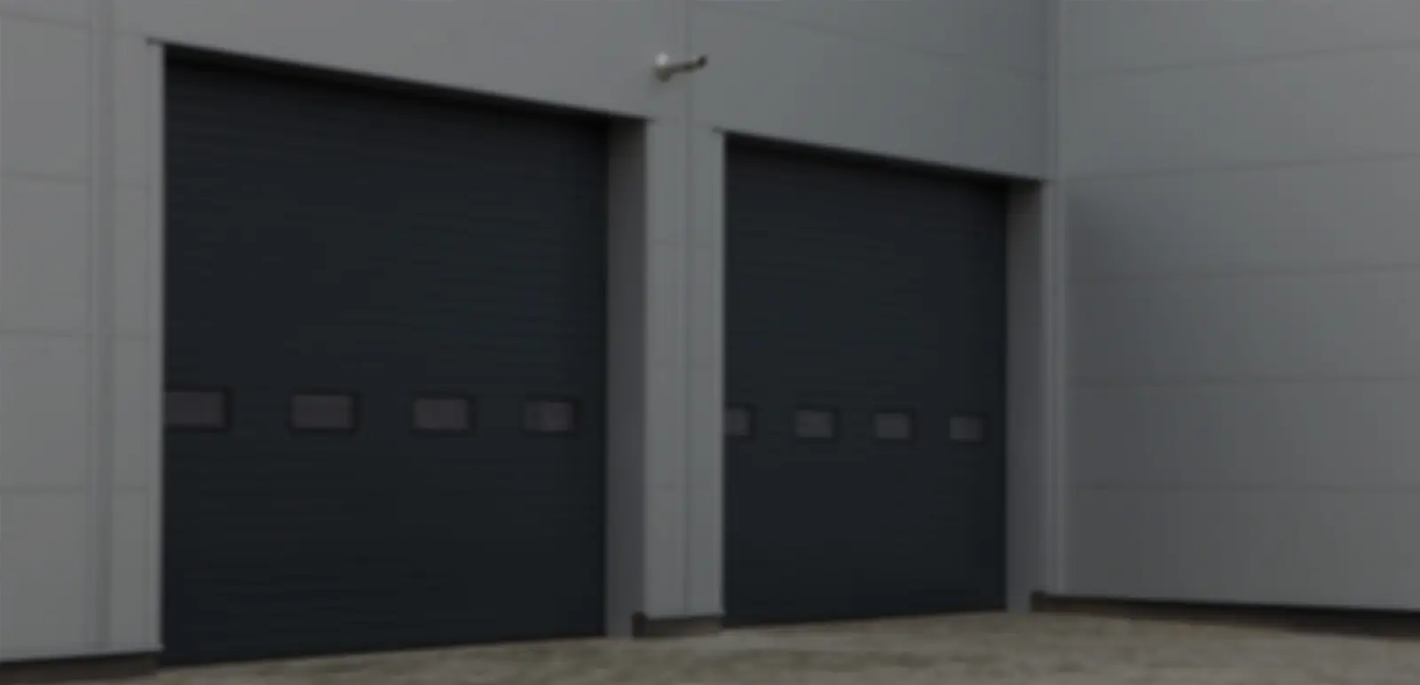Warehouse with two large garage doors closed.