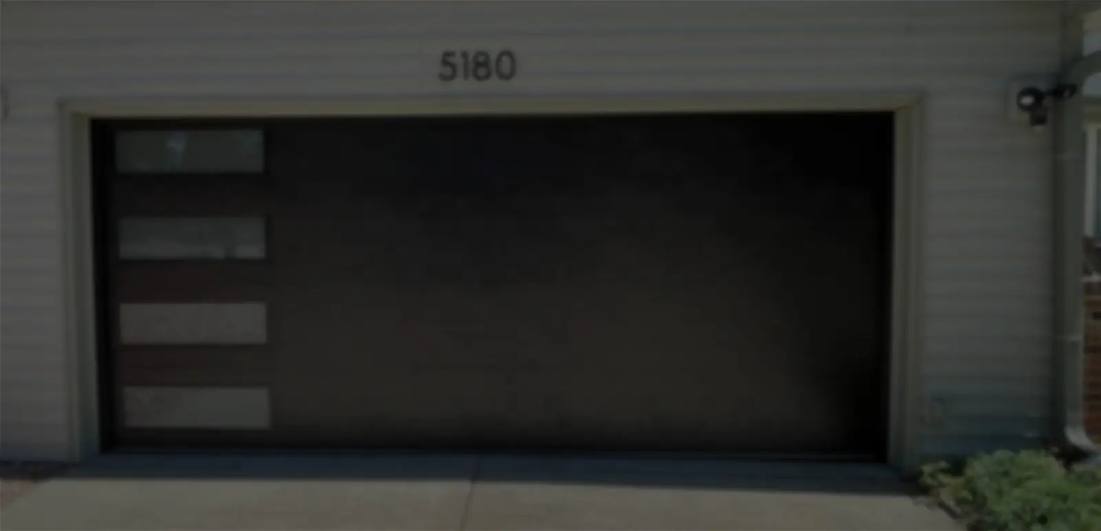 Modern garage door with house number 5180