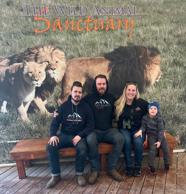 Family sitting at Wild Animal Sanctuary