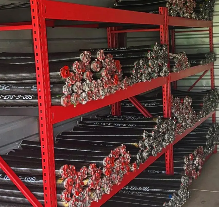 Red shelves storing coiled metal springs.