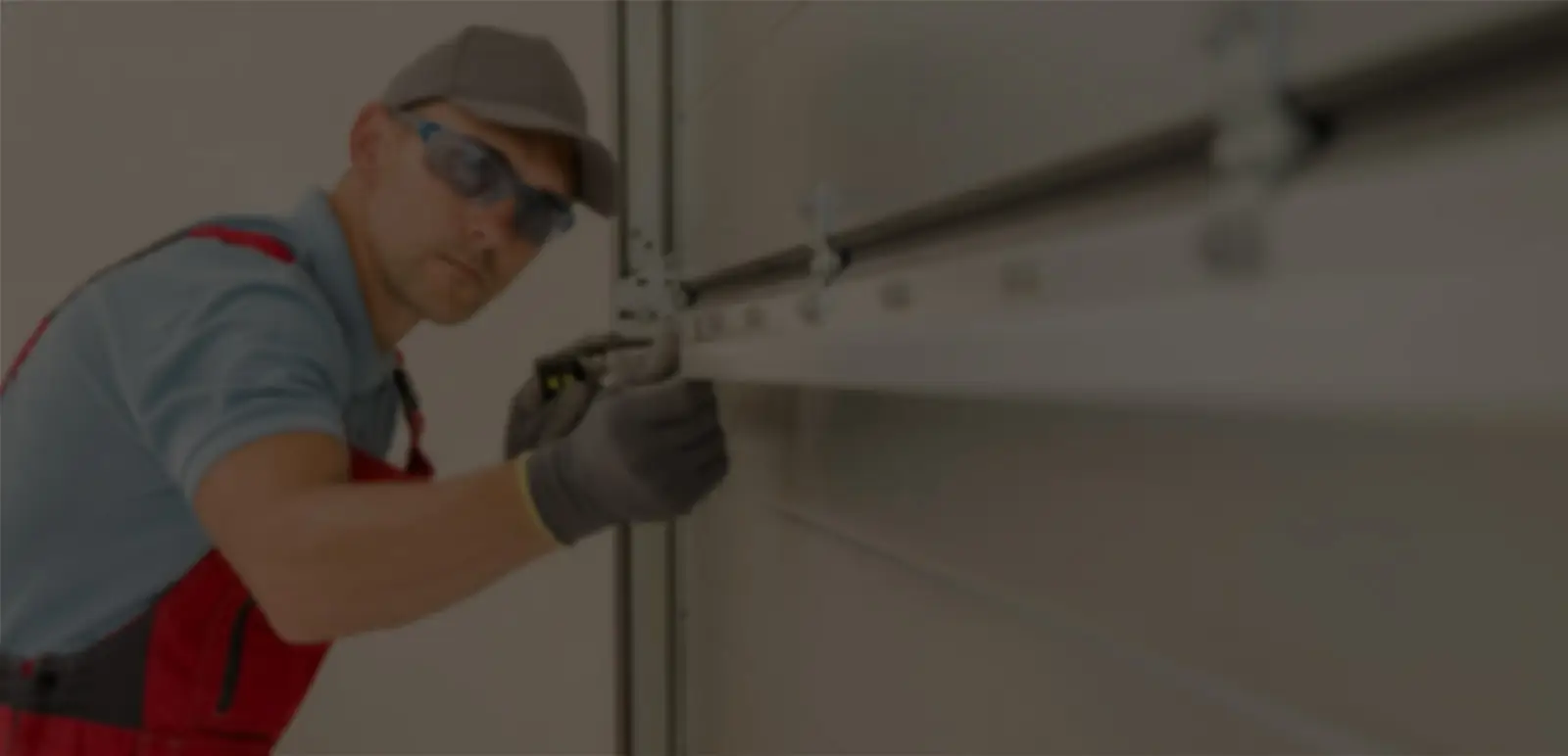 Technician installing a garage door
