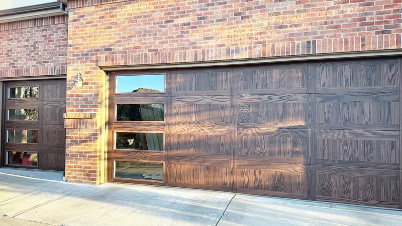 Modern wooden garage door on brick building