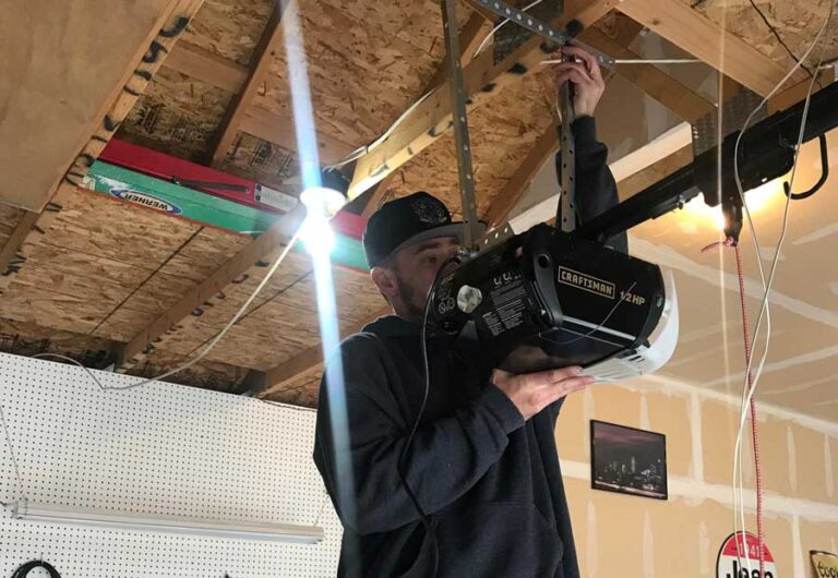 Man installing Craftsman garage door opener