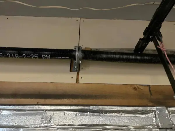 Garage door tension spring and assembly