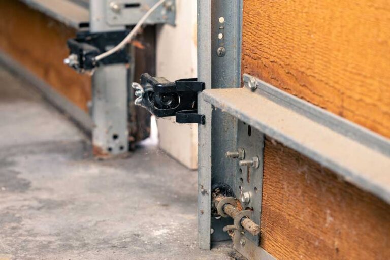Garage door hinge and metal track close-up