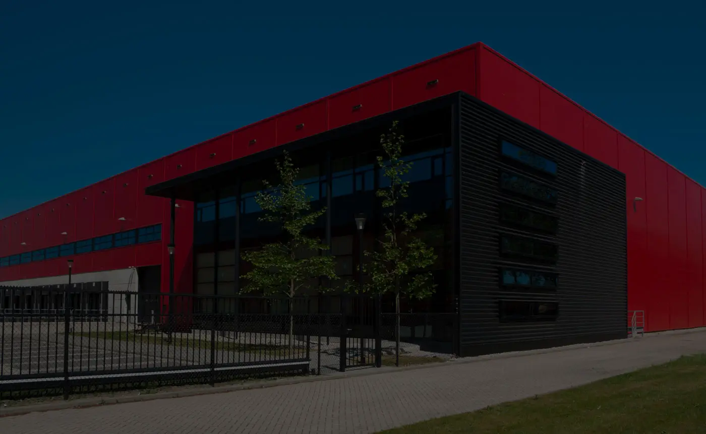 Modern red and black industrial building exterior